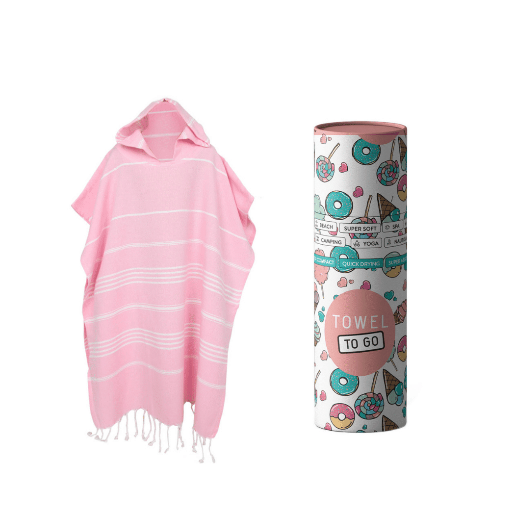 Ipanema Kids Poncho Towel in pink, made from 100% cotton, featuring a hood and packaged in a recycled gift box.